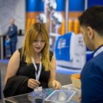 Medical Device Innovator speaking with LSO team member at OMTEC 2025 booth