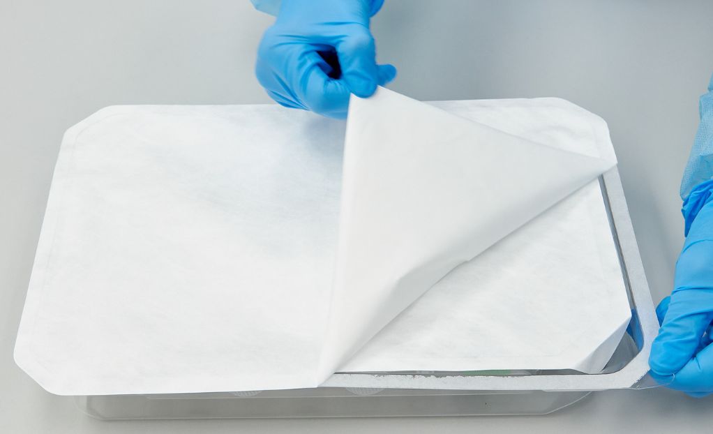 Medical device neatly placed in a tray, securely sealed with a Tyvek cover.