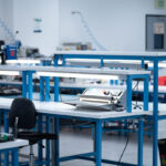 Spacious and well-lit Class 7 cleanroom facility equipped with workstations and tools for medical device manufacturing and assembly.Spacious and well-lit Class 7 cleanroom facility equipped with workstations and tools for medical device manufacturing and assembly.