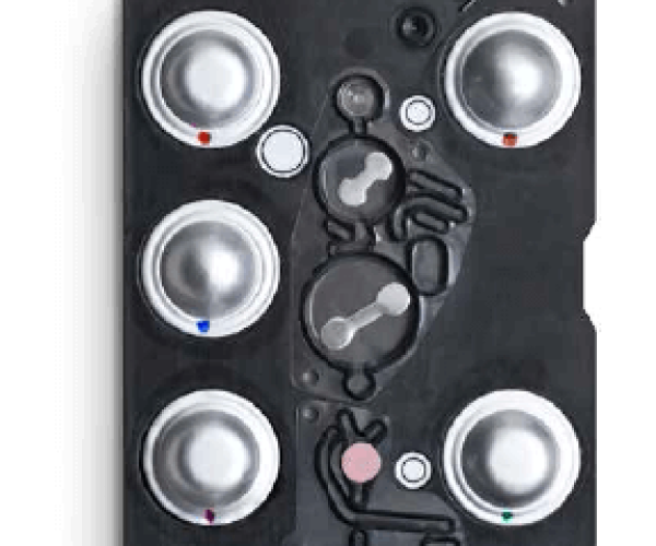 Microfluidic Diagnostic Cartridge with Reagent Blisters A microfluidic diagnostic cartridge featuring multiple reagent blisters and intricate fluid pathways for automated testing.