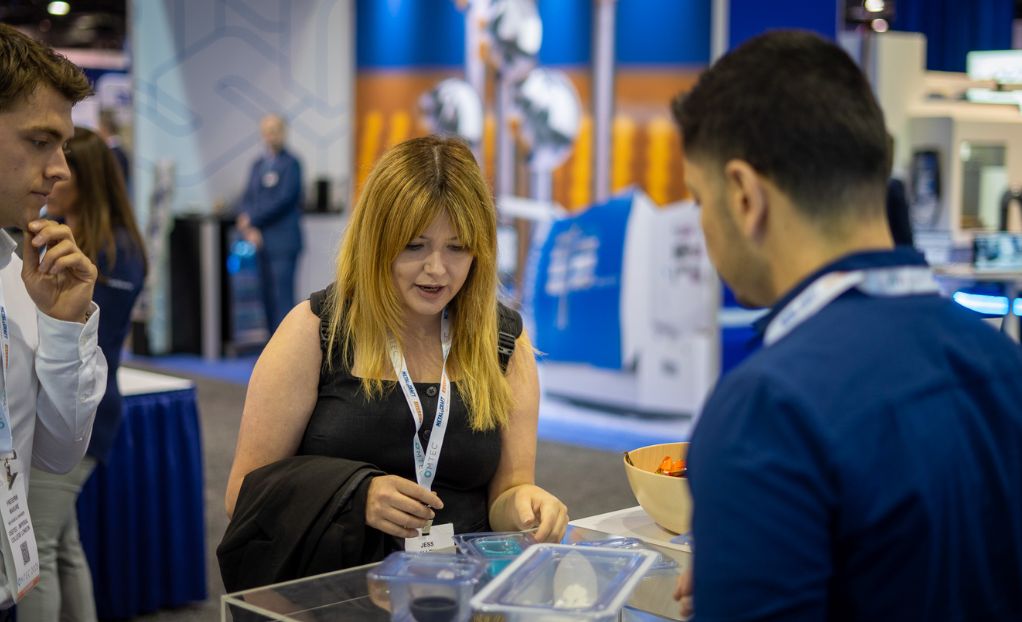 Medical Device Innovator speaking with LSO team member at OMTEC 2025 booth